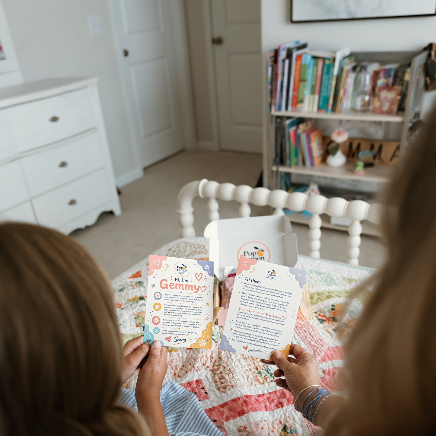 Mother and daughter using Pop Lemon conversation cards to talk about a first period